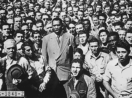 Paul Robeson leading shipyard workers in singing the “ The Star Spangled Banner” in Oakland, California, 1942.